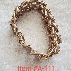 A gold bracelet with vase flower design, wt. 49 grams , item # A-111